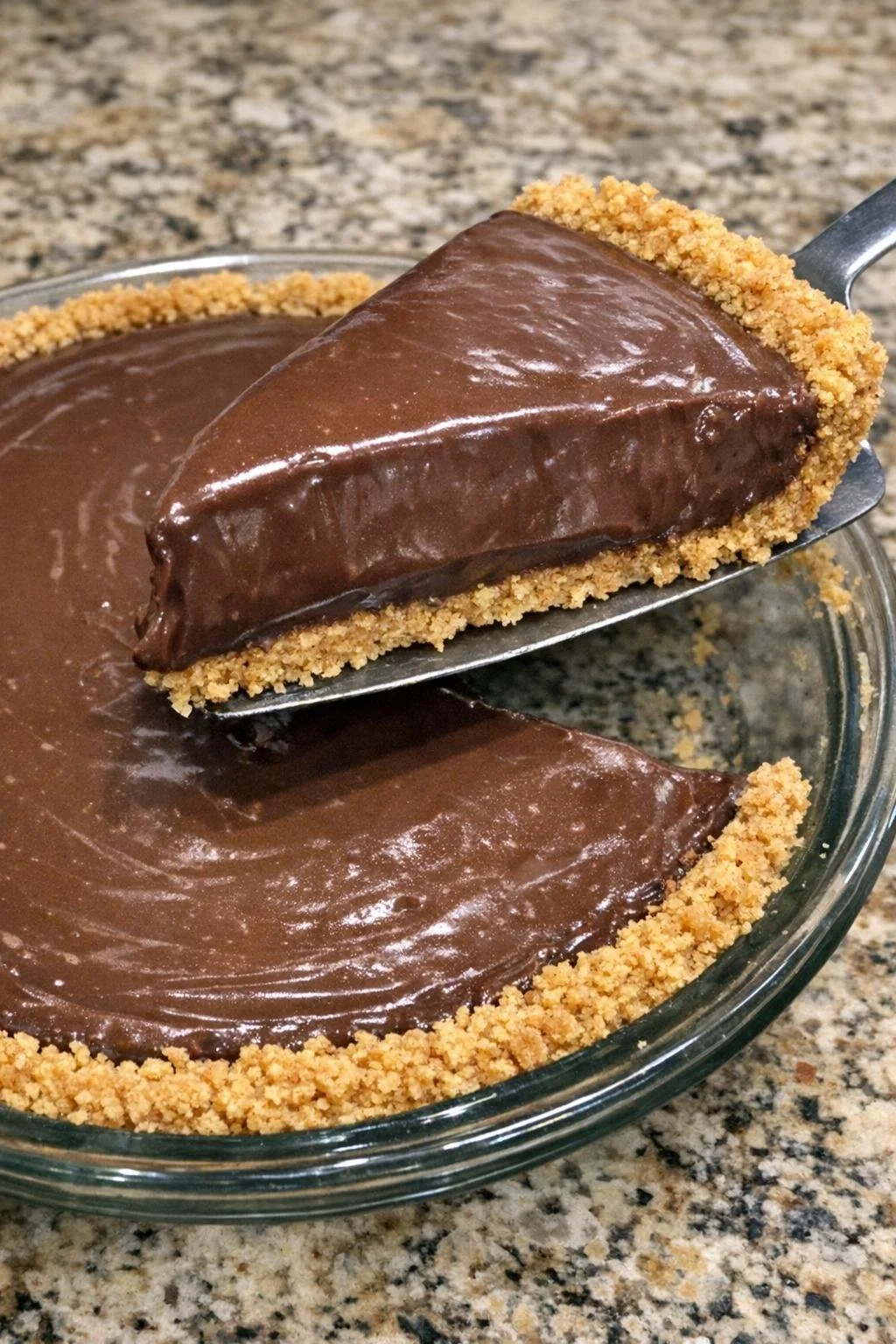 Delicious 3 Ingredient Hershey Bar Pie topped with chocolate and whipped cream.