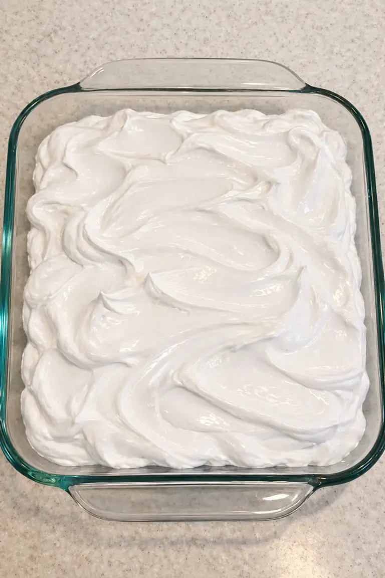 4-Ingredient Baked Marshmallow Fluff Dessert in a glass baking dish