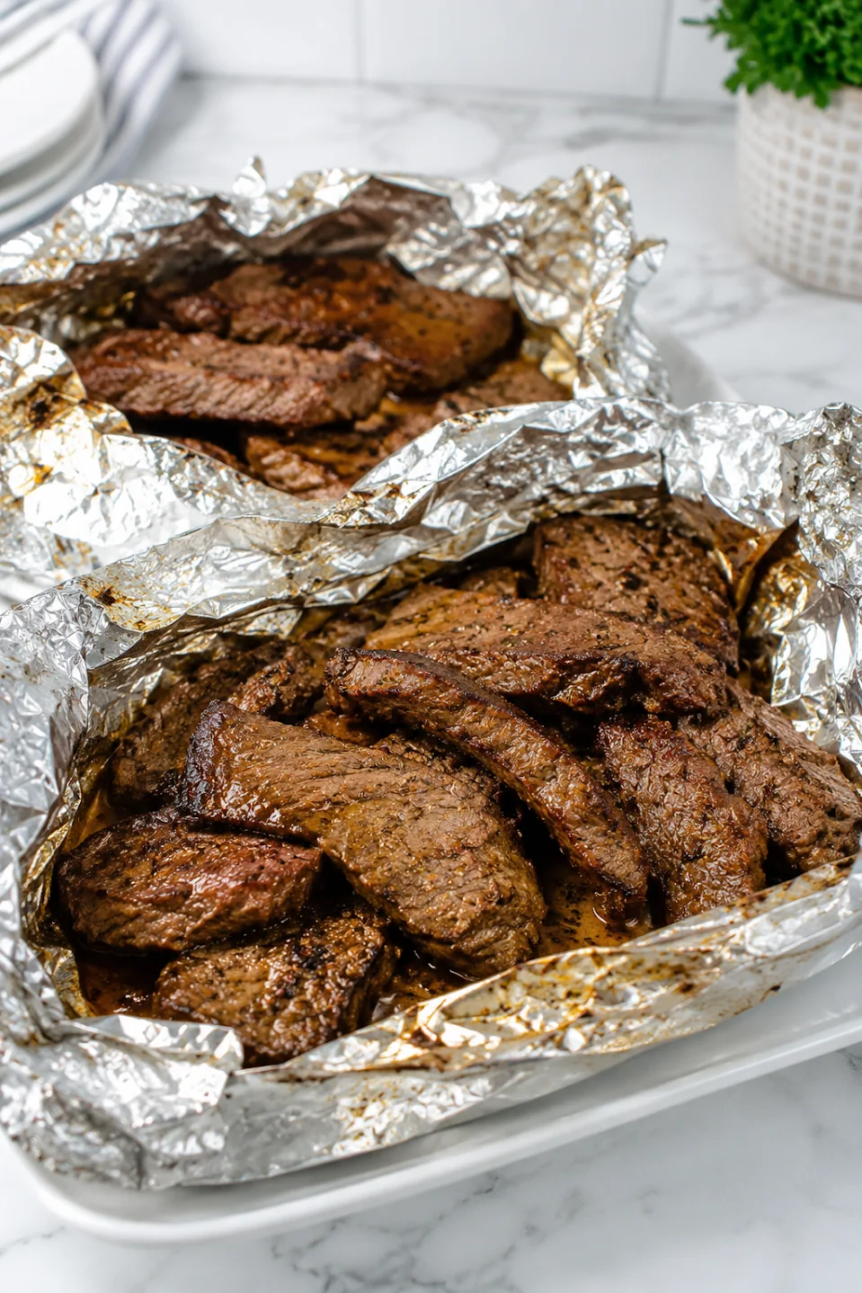 Cooked Cajun steak served directly from an open foil packet