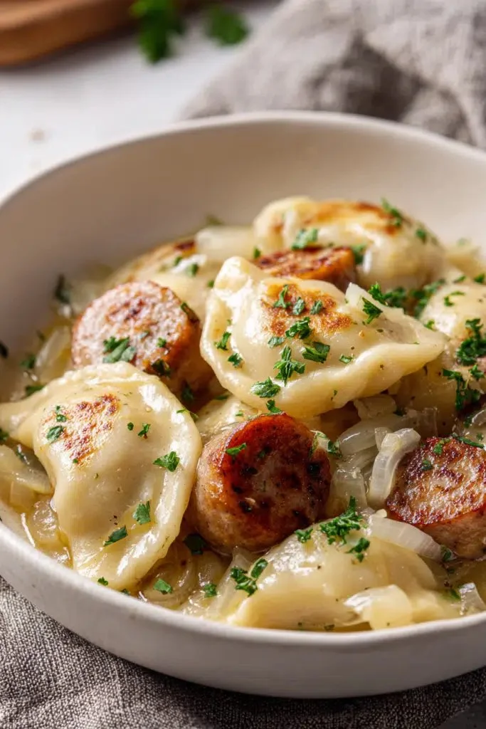 Crockpot foil packet meal featuring sausage and pierogies ready to serve.