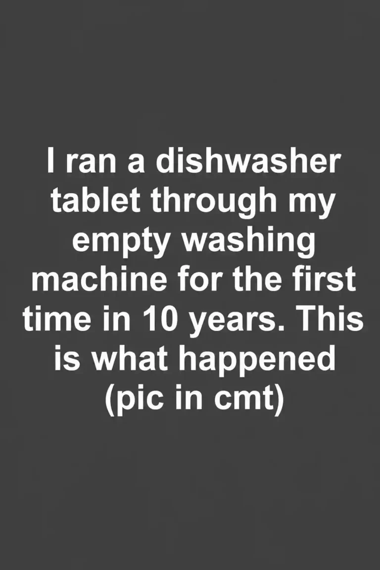 Dishwasher tablet being placed inside an empty front-loading washing machine drum
