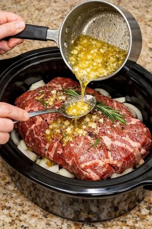 Succulent Garlic Butter Beef Chuck Roast served with herbs and vegetables