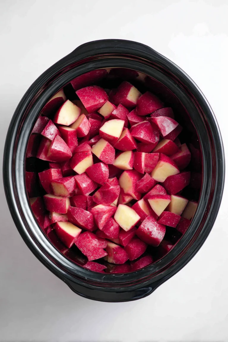 Cubed potatoes placed in a slow cooker