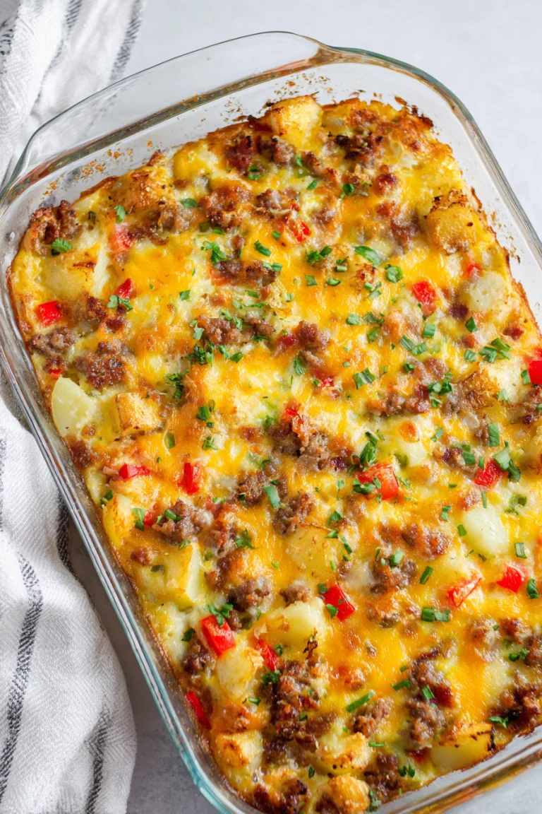 Golden baked breakfast casserole in a rectangular glass baking dish