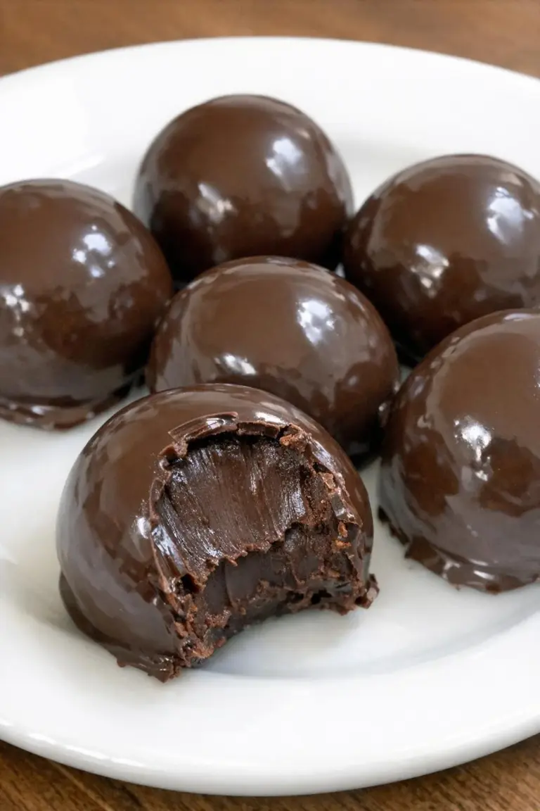 Low carb 2-ingredient chocolate truffles on a white plate