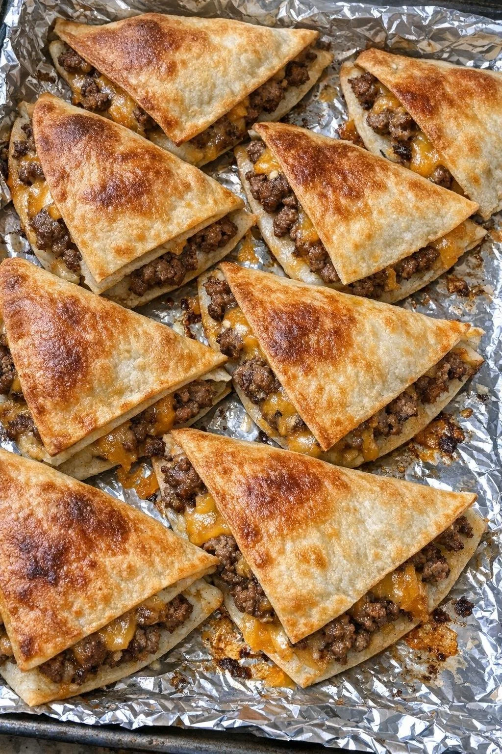 Oven-baked beef quesadilla wedges with melted cheese and perfect crust