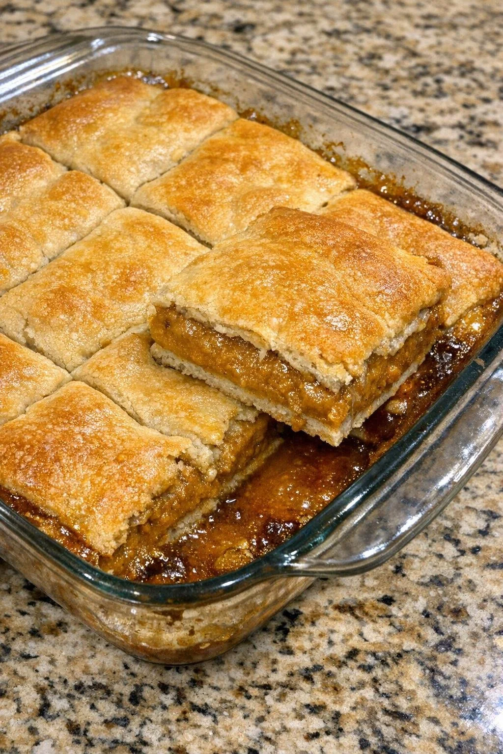 Finished pumpkin pie slabs in a glass baking dish