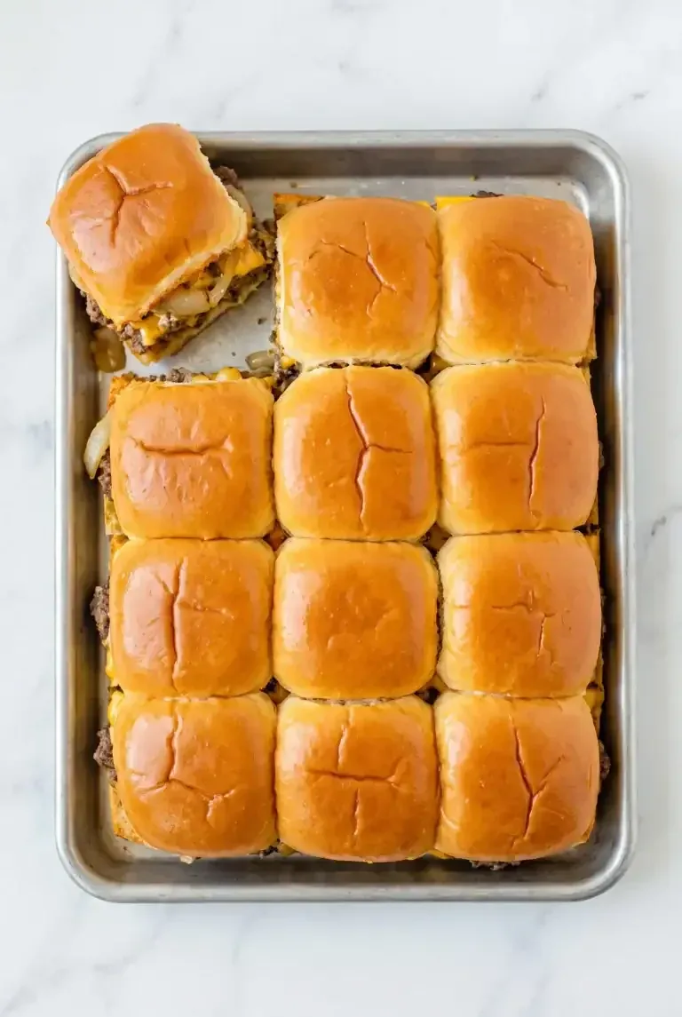 Twelve assembled sheet pan slider rolls on a tray