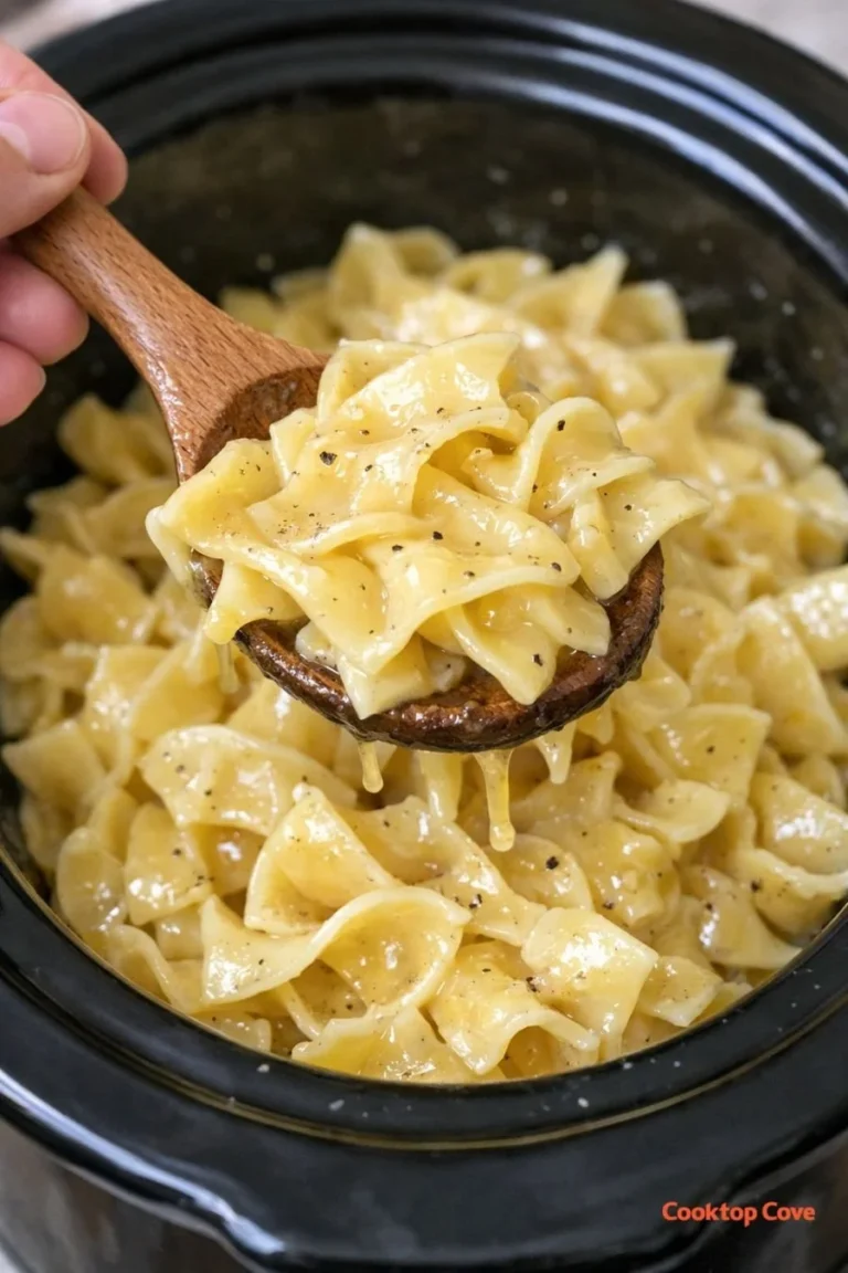Bowl of creamy Slow Cooker 3-Ingredient Amish Butter Noodles garnished with parsley