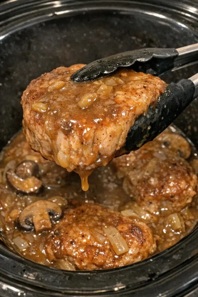 Slow Cooker 4-Ingredient Smothered Pork Chops served on a plate