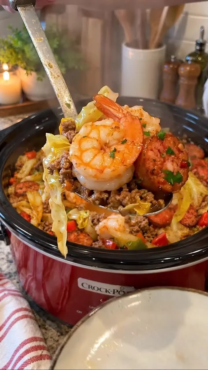 Delicious Slow Cooker Cajun Shrimp & Sausage Cabbage dish served in a bowl.