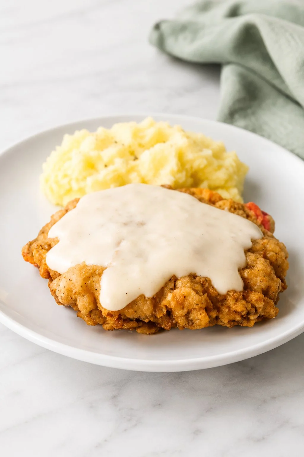 Southern chicken-fried steak served with creamy gravy