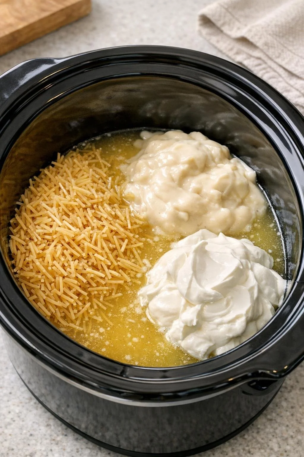 Four vermicelli ingredients placed in the slow cooker